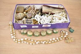 An assortment of costume jewellery, including shell necklaces, cufflinks, stick pins, faux pearls