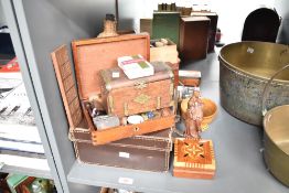 An early 20th century leather travel case, L45cm, sold together with a Chinese wooden figure, a pack
