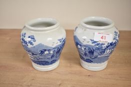 A pair of Fortnum & Mason honey pots of baluster form, decorated with blue and white landscape