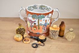 An early 20th century Chinese double handled tankard/loving cup, decorated with figures within a