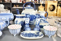 A blue and white ceramic tea pot with cover decorated with 19th century English town scene, h28cm,