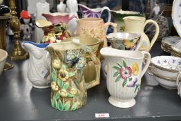 A quantity of ceramic pitchers, makers include Redford Butterfly ware, Brentleigh ware and Tuscan