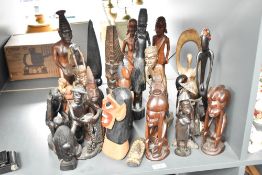 A large group of carved African tribal figures, largest h37cm