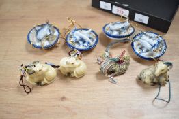 A set of 4 porcelain hanging fish plates, w6cm, sold together with two water buffalos, a ram and