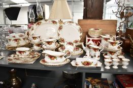 A Royal Albert 'Old Country Rose' pattern dinner service, having gilt edge and decorated with floral