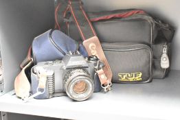 A Canon T50 camera with cover and carry case