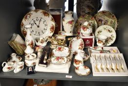 A Royal Albert 'Old Country Rose' dinner service having gilt edge and floral designs, to include