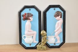 A pair of cast metal bathroom signs, h17.5cm, sold together with a small brass sign, (3)