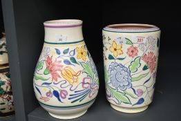 A Poole pottery vase of baluster form, having floral decoration, h25cm, sold together with another