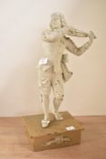 A cast iron sculpture of a gentleman in classical dress playing the violin, h40cm