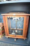 A early 20th century cased laboratory balance scale contained within a glazed wooden case having