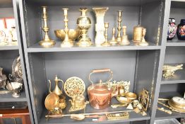 A quantity og brass ware, to include candlesticks, trivet, nut cracker and copper swan neck kettle