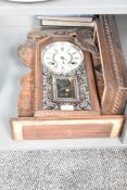 A late 19th century Ansonia (USA) Gingerbread clock having single gong chime, h56