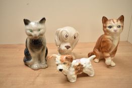 A ceramic terrier dog figure, L15cm, sold together with two cat figures and a dog, (4)