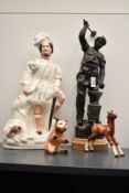 A spelter blacksmith sculpture, h42cm, sold together with a Staffordshire highlander, a ceramic bear