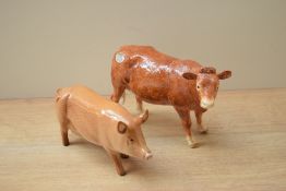 A Border Fine Arts Limousin Cow sold together with a Royal Doulton bone china Tamworth pig study.