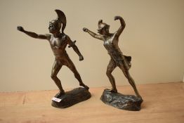 A pair of brass gladiators/spear throwers, missing their weapons, without any markings/signatures