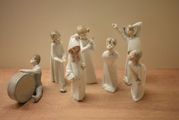 A group of seven Lladro porcelain figures and figurines including 'Boy with Drum' model number 4616,