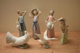 A group of six Lladro figurines and studies comprising 'Dreamer' model number 5008, 'Curious Girl