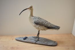 A hand carved and painted Curlew study by Mike Wood, having date 'Feb 2006' and signature to