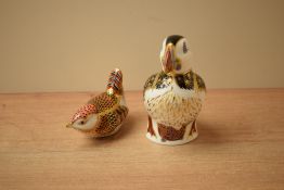 Two Royal Crown Derby bone china bird paperweights comprising Puffin having gold coloured stopper