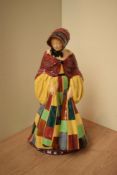 A Royal Doulton bone china figurine 'The Parson's Daughter' HN 564, measures 25cm tall.