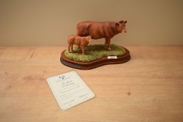A Border Fine Arts limited edition figure group 'Limousin Cow & Calf' model number L157, modelled by