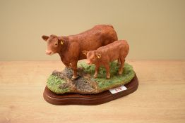 A Border Fine Arts figure group 'Limousin Cow & Calf' model number A8952.