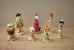 A group of seven John Beswick pottery studies of the Flintstones comprising 'Fred Flintstone', '