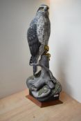 A hand carved and painted Goshawk study by Mike Wood, having date '1/97' and signature to underside,