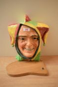 A Royal Doulton wall mask 'Jester' , HN 1630, designed by Harry Fenton (1936-1940), well coloured,