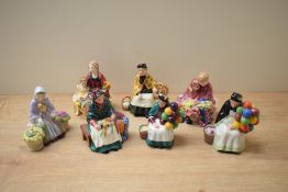 Seven Royal Doulton bone china miniature street vendor figurines comprising 'The Old Balloon Seller'