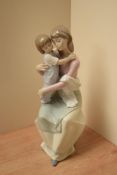 A Lladro porcelain figure group 'A Mother's Love' model number 6634, measures 28cm tall, complete
