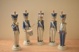 A group of five Lladro porcelain cadets comprising cadet with rifle, cadet with trumpet, cadet