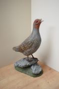 A hand carved and painted Grey Partridge study by Mike Wood, having date 'March 2002' and