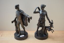 A pair of appealing reproduction cast patinated metal studies depicting Athena/Diana and Apollo,