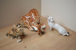 A Russian Lomonosov porcelain study of a seated Tiger cub marked USSR to underside together with a