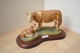 A Border Fine Arts limited edition figure group 'Simmental Cow & Calf' model number L21 modelled