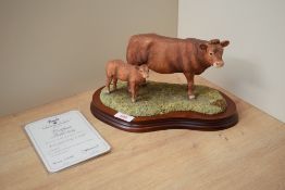 A Border Fine Arts limited edition figure group 'Limousin Cow & Calf' model number L157, modelled by