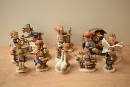 A large group of thirteen Goebel porcelain figures and figurines including 'Retreat to Safety' model