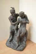 A large patinated metal figure group depicting 'Pan and Daphnis', having areas of oxidisation,