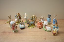 A group of thirteen Beswick Pottery and Royal Albert Beatrix Potter characters to include 'Mr