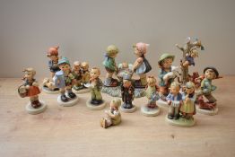 A group of thirteen Goebel porcelain figures/figurines to include 'Special Delivery' model number BH