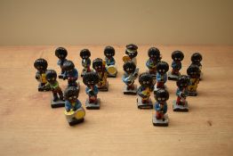 A group of nineteen vintage Robertson Jam figures, all having ware commemorative with age.