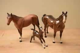 A group of three Beswcik Pottery animal studies comprising 'Swish Tail Horse' model number 1182 (