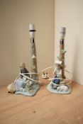 A pair of Nao by Lladro porcelain figure groups depicting a girl with bunnies and a boy with lambs