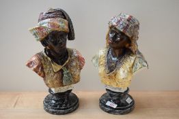 A pair of 20th century continental pottery, Blackamoor busts, the male with previous damages to