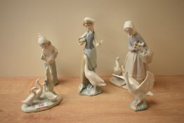 A group of five Lladro and Nao by Lladro porcelain figures/figurines comprising 'Girl with