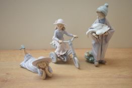 A Lladro porcelain figurine 'Follow Us' model number 6101 sold alongside two Leonardo Collection