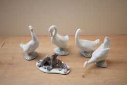 A Lladro porcelain seal family model number 5318 sold alongside group of four Nao by Lladro
